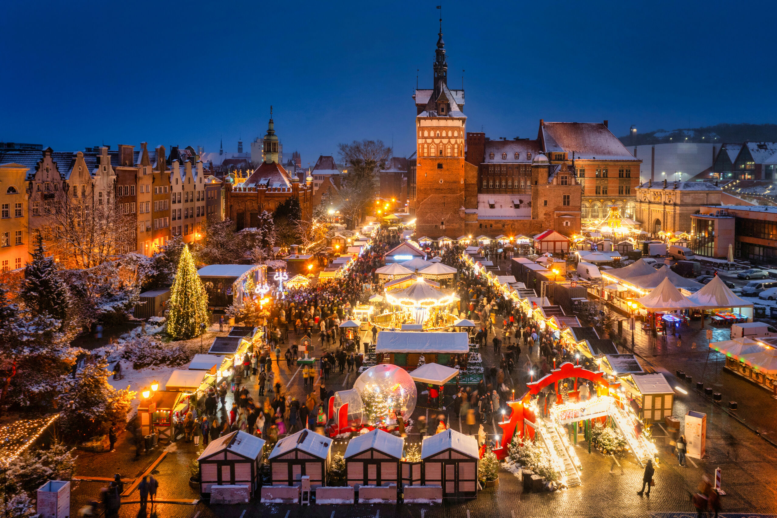 Beautifully lit Christmas fair in the Main City of Gdansk at dusk. Poland Beautifully lit Christmas fair in the Main City of Gdansk at dusk. Poland